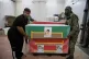 Coffins holding the bodies of mostly children are prepared for the funeral of those killed in what Iranian officials said was an Israeli-U.S. strike Feb. 28 at a girls' elementary school in Minab, Iran, Tuesday, March 3, 2026