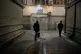 People walk past closed shops at the nearly empty traditional main bazaar in Tehran, Iran, March 10, 2026