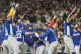 Venezuela's Javier Sanoja is swarmed by his teammates after scoring during the ninth inning in the championship game of the World Baseball Classic against the United States in Miami,  March 17, 2026