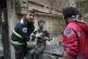 A first responder assists an injured boy following a US-Israeli strike that hit a residential building in Tehran, Iran, March 28, 2026