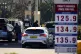 People dispense fuel at the pump at Costco Petrol Station in West Thurrock, Essex. The conflict in Iran has caused a surge in oil and gas prices, March 5, 2026