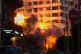 An explosion erupts from a building following an Israeli strike in central Beirut, Lebanon, March 18, 2026