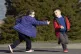 Two children play tag in the school ground of Scoil Naomh Lorcan in Omeath, Northern Ireland, March 2021