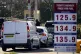 People dispense fuel at the pump at Costco Petrol Station in West Thurrock, Essex, March 5, 2026