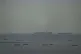 CRISIS LOOMING: Fishing boats dot the sea as cargo ships, in the background, sail through the Arabian Gulf toward the Strait of Hormuz off the United Arab Emirates, Friday March 27 2026