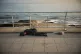A boy sleeps out in the open beside the roses he sells to passersby to make a living, along a seaside promenade in downtown Beirut, Lebanon, April 5, 2026