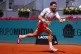 Cameron Norrie returns the ball to Jannik Sinner of Italy during their round of 16 match at the Madrid Open tennis tournament in Madrid, April 28, 2026