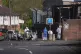 Forensic investigators at the scene in Dunmurry in Northern Ireland after a car explosion outside a police station, April 26, 2026