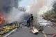 Rescuers try to extinguish a fire after a passenger bus collided with a fuel truck in Musi Rawas, South Sumatra, Indonesia, May 6, 2026