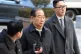 Former South Korean Prime Minister Han Duck-soo, center, arrives at the Seoul Central District Court for his first sentencing trial in the insurrection case, in Seoul, South Korea, January 21, 2026