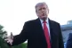 President Donald Trump speaks as he visits the Lincoln Memorial Reflecting Pool to see the new blue protective coating being applied as part of a renovation project, May 7, 2026, in Washington