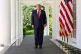 President Donald Trump walks through the Colonnade of the White House as he arrives to attend a luncheon for mothers, May 8, 2026, in the Rose Garden of the White House, in Washington