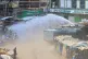 Police use a water cannon to disperse protesters on the second day of a public transport strike over fuel prices in Nairobi, Kenya, May 19, 2026