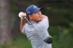 Si Woo Kim, of South Korea, watches his tee shot on the 14th hole during the first round of the Byron Nelson golf tournament in McKinney, Texas, May 21, 2026