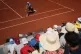 Toby Samuel of Britain returns to Alex De Minaur of Australia during their first round men's singles tennis match at the French Open tennis tournament in Paris, May 25, 2026