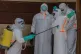 Health workers disinfect themselves after preparing the body of an Ebola victim at Citadelle Clinic in Bunia, Congo, June 12, 2026