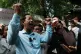 Rong Chhun, a prominent Cambodian opposition politician, gestures to his supporters after a Supreme Court hearing in Phnom Penh, Cambodia, June 15, 2026