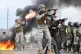 Police fire tear gas at anti-government protesters blocking a highway in Vinto, Bolivia, June 8, 2026