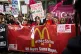 Fastfood workers demand better pay in London's Leicester Squ