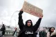 SIDING WITH PALESTINE:
A woman protester spells it
out on a 
