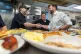 THE COMMON TOUCH: Vance poses for photos with kitchen staff 
