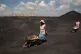  Women push wheelbarrows at the coal-powered Duvha power sta