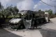 EXTREMIST IDEOLOGY: A Palestinian boy looks at burnt cars in