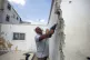 A Palestinian man in East Jerusalem is forced to knock down 