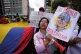 NEW ERA: A woman holds an image of Colombia’s President Gu