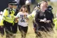 A Just Stop Oil protester is taken away by police during day
