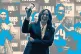 DEFEATED: Kamala Harris holds up a phone as she phone banks 