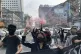Members of a youth group hold a flash mob rally to protest a