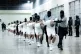 GLEEFULLY BRUTAL: Prison guards transfer deportees from the 