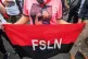 GENDER EQUALITY: A woman holds a Sandinista party flag at In