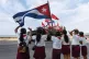 RESILIENCE: Schoolchildren wave the national flag during cel
