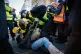 A young protester is pounced on by police officers on Whiteh