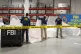 In this image provided by the FBI, special agents assigned t