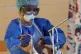 A healthcare worker attends to a Covid-19 patient in an inte
