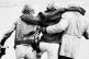 An injured miner is helped away after a scuffle at the same 