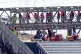 A group of people thought to be migrants are brought in to D