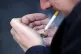 A man smoking a cigarette