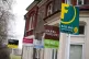 A row of To Let estate agent signs placed outside houses in 