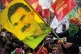 A youth holds a flag with the image of Abdullah Ocalan, the 