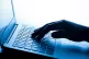 A person pressing a key of a laptop keyboard, March 4, 2017