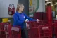 A worker sanitises shopping carts during the coronavirus out