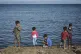 Children stand by the sea at the Kara Tepe refugee camp, on 