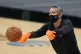 San Antonio Spurs assistant coach Chip Engelland wears a fac