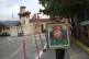 A man holds a painting of late President Hugo Chavez as he w