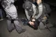 A Palestinian youth is pinned down by Israeli police after h