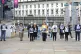 Family members arrive for the inquest into holding photos of